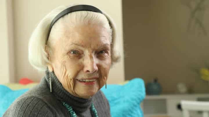 Smiling senior woman on a sofa