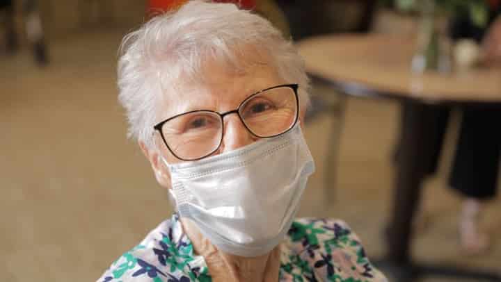 Senior woman wearing a protective mask