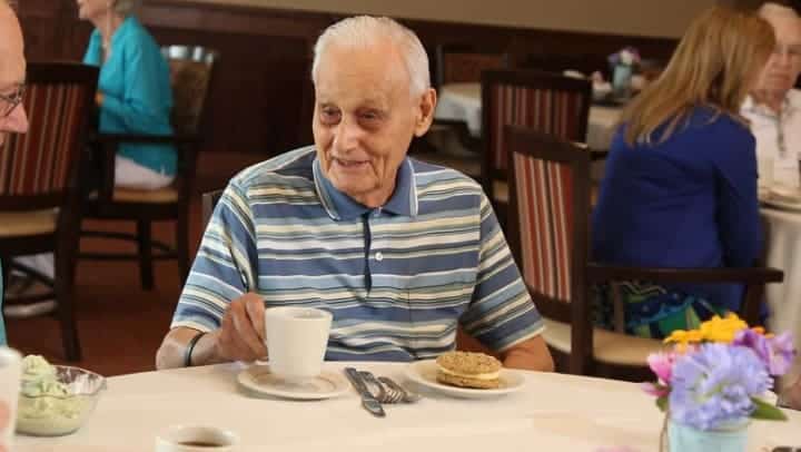 senior man eating a nutritious breakfast