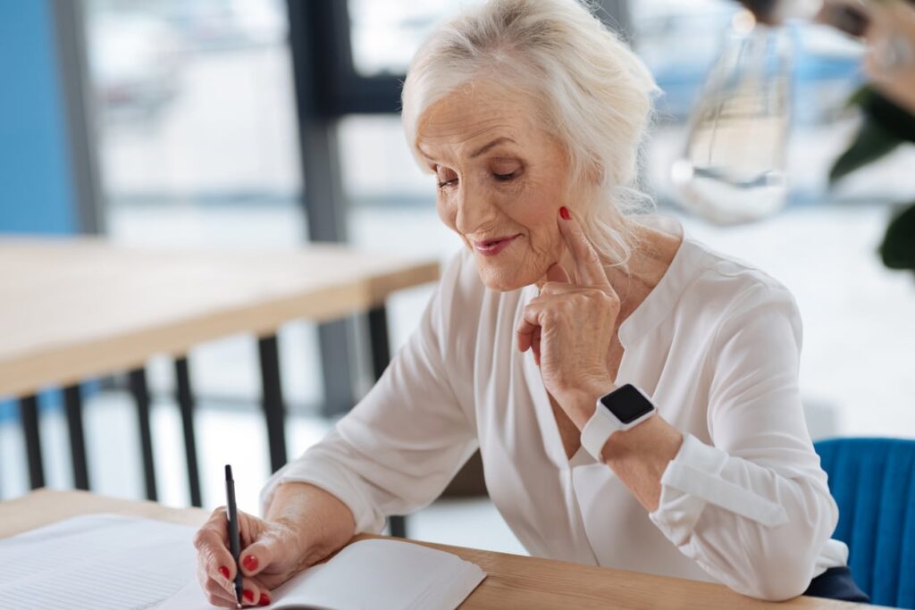 Happy aged woman choosing a senior living community