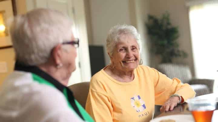 senior man and woman laughing together