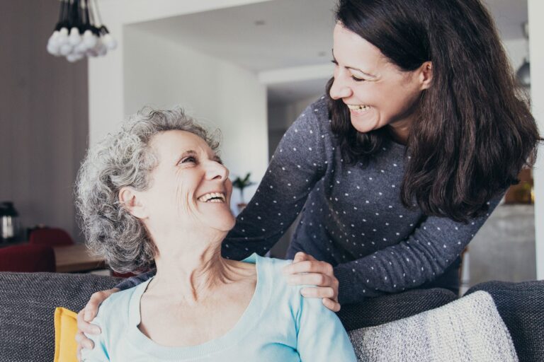 Senior woman speaking with her daughter about Assisted Living