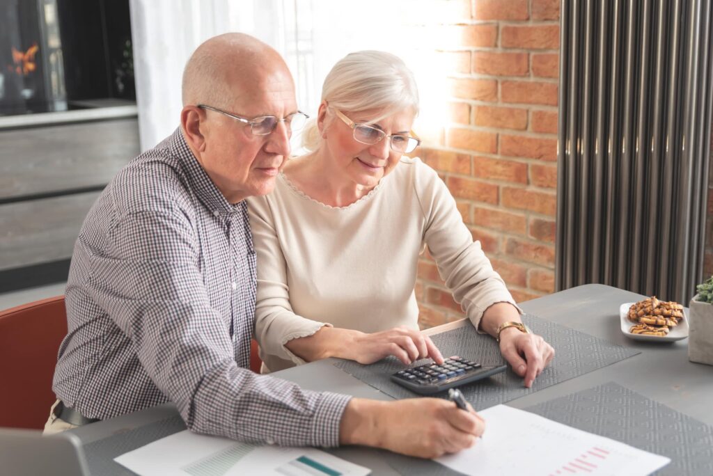 Senior couple calculate financial billing