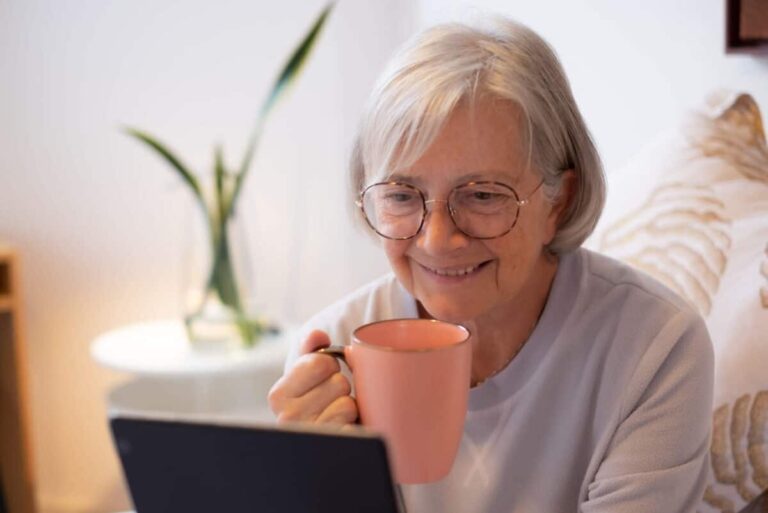 Older adult women on computer planning a successful move into senior living