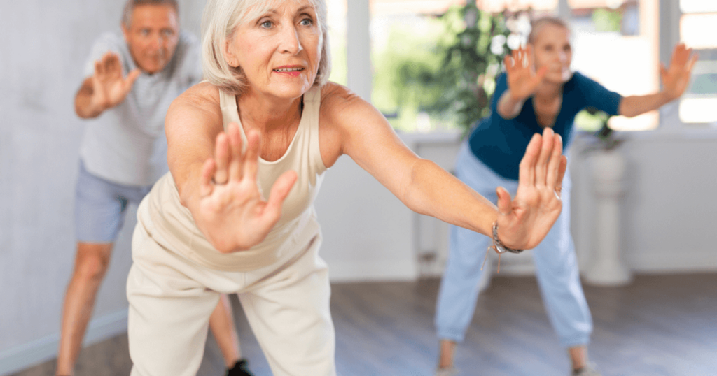 Senior women in yoga practicing fun exercises and activities