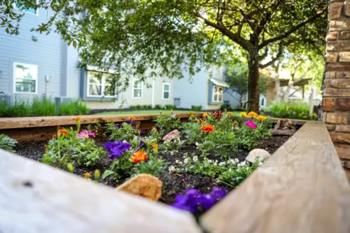 Heritage Pointe assisted living courtyard raised flower beds