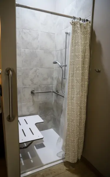 Heritage Pointe assisted living model apartment walk-in shower with seat