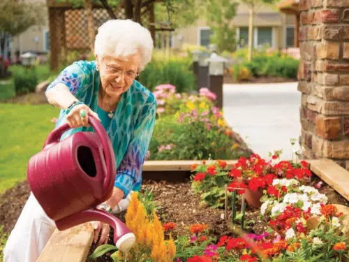 Resident watering plants in the courtyard​