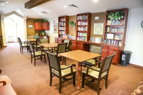 The Heritage at College View Library with desk and chairs