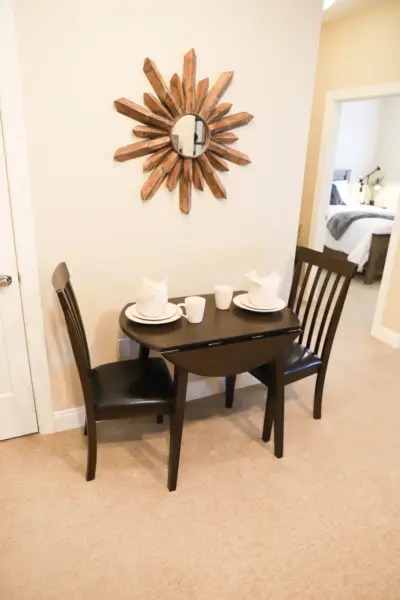 The Heritage at Fountain Point dining room table at an assisted living apartment