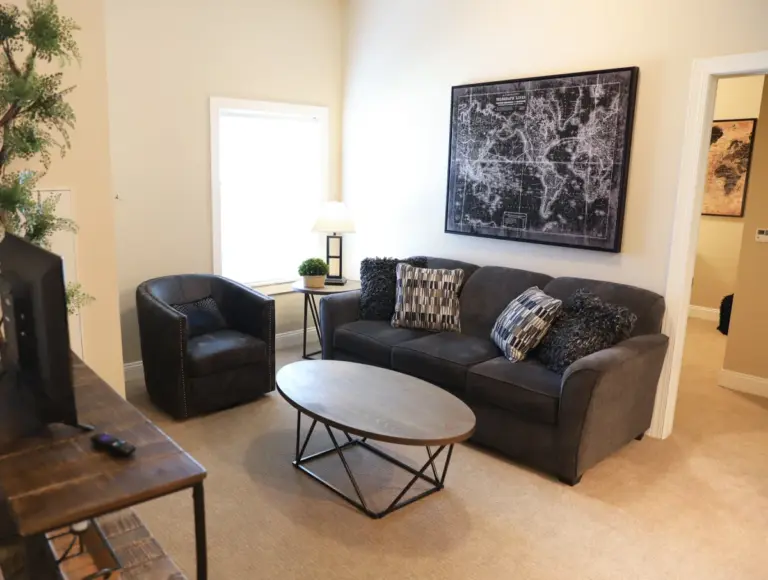 The Heritage at Fountain Point sofa and chair at an assisted living apartment