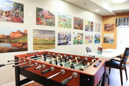 The Heritage at Fox Run community room and foosball table