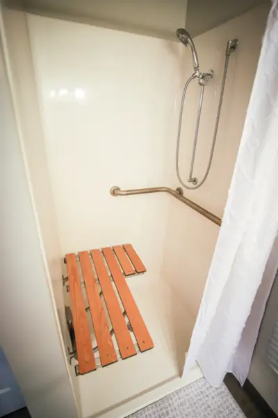 The Heritage at Shalimar Gardens assisted living apartment walk-in shower with seat​