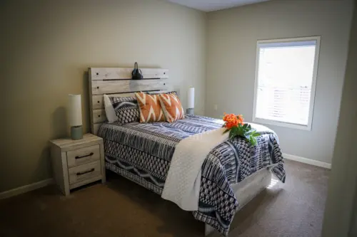 Heritage Ridge senior living model apartment bedroom