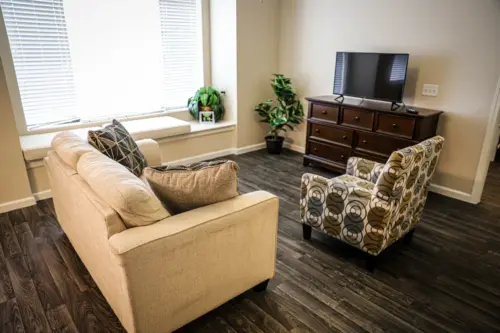 Orchard Pointe at Arrowhead assisted living apartment living room with window seat