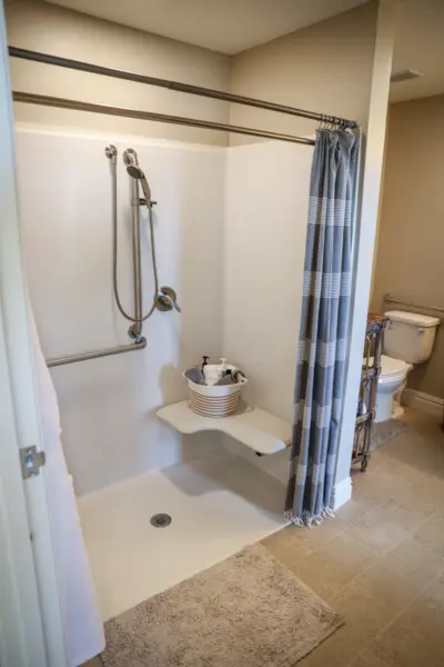 Orchard Point at Creek Valley independent living apartment bath with walk-in shower and seat