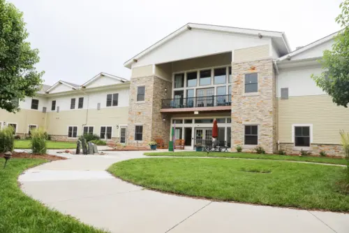 The Heritage at Sagewood Assisted living courtyard with walking paths and deck