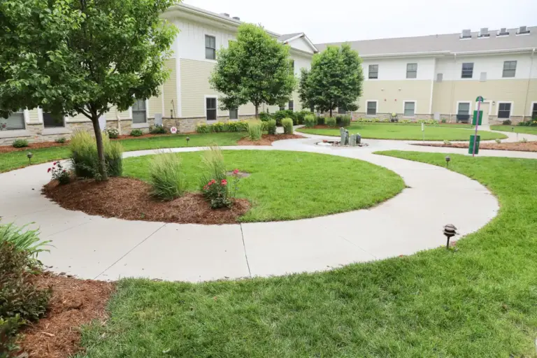 The Heritage at Sagewood Assisted living courtyard with walking paths