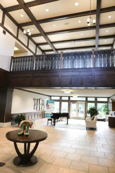 The Heritage at Sterling Ridge main lobby with piano