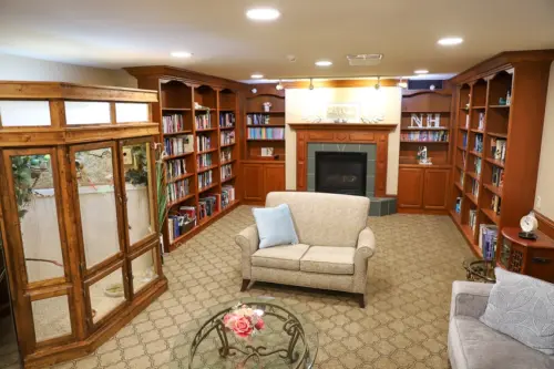 The Heritage at Northern Hills assisted living library and aviary