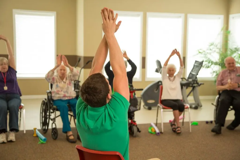 seniors stretching as part of a memory care activities calendar